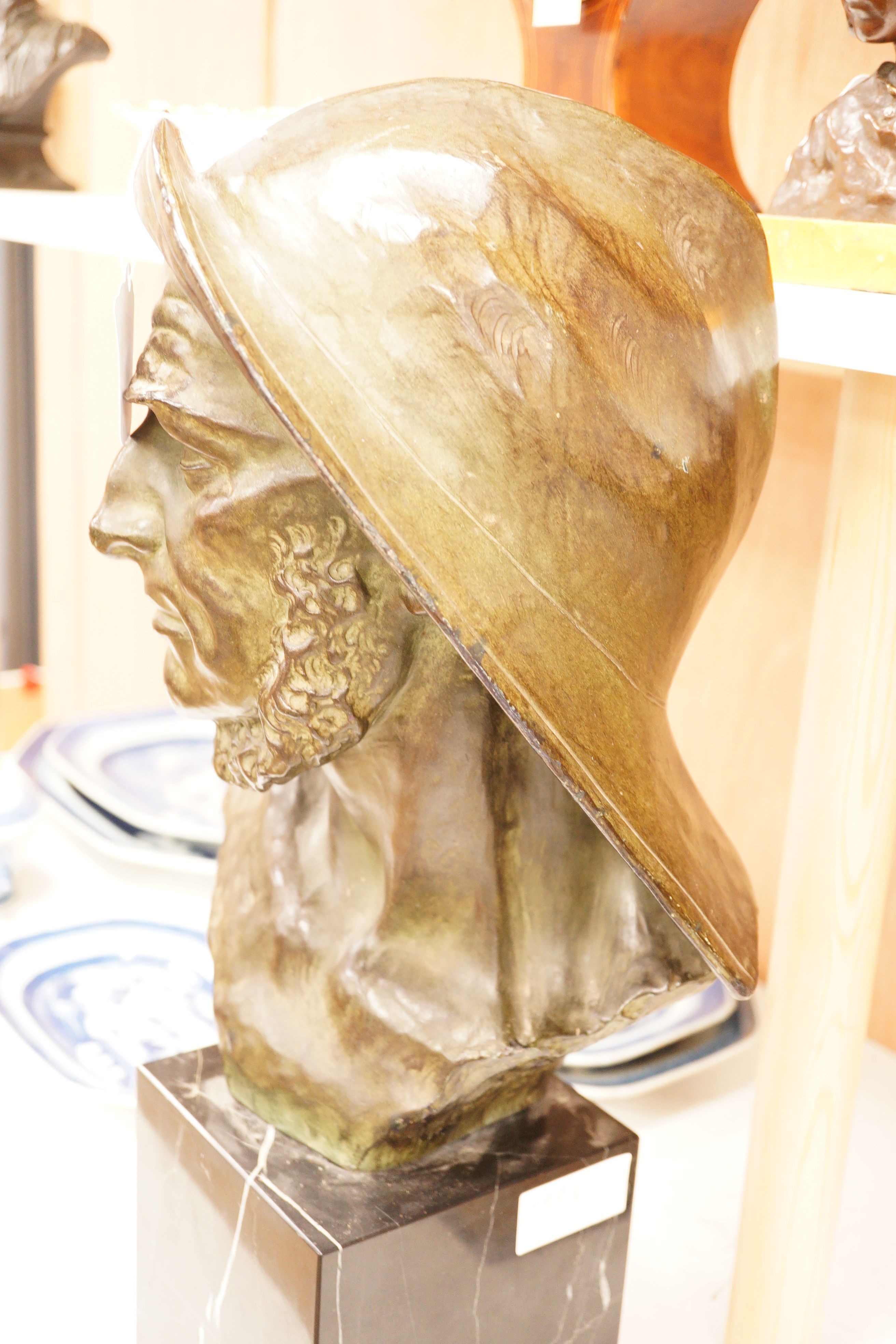 Johannes Dommisse (1878-1955) A cold painted terracotta bust of a fisherman on plinth base, 53cm tall
